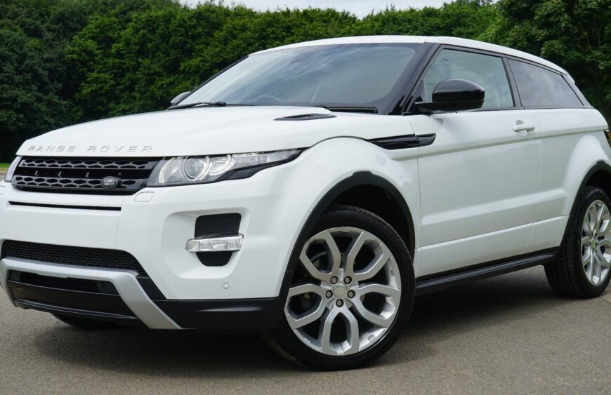 white land rover range rover suv on road